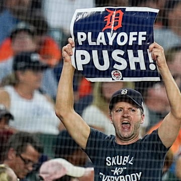 A Detroit Tigers fan holds a Playoff Push sign to cheer for the Tigers during the sixth inning against Baltimore Orioles at Comerica Park in Detroit on Saturday, September 14, 2024.