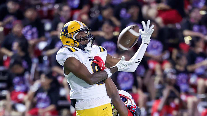 Fort Bend Marshall (Texas) receiver Ja’Kyron Edmonds makes a leaping reception over a Dallas Skyline defender.