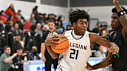 Salesian's Carlton Perrilliat (21) goes baseball en route to his 20 point night in a loss to St. Joseph Santa Maria last month. On Wednesday, he led the Pride with 19 points in a 66-53 win over Modesto Christian at Albany High School. 