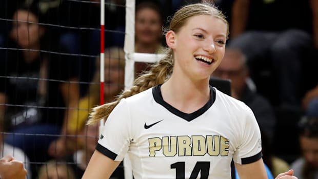 Purdue Boilermakers Grace Heaney (14) celebrates after scoring a point