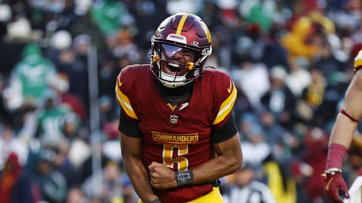 Dec 22, 2024; Landover, Maryland, USA; Washington Commanders quarterback Jayden Daniels (5) celebrates after throwing the game winning touchdown during the fourth quarter against the Philadelphia Eagles at Northwest Stadium. Mandatory Credit: Peter Casey-Imagn Images Dec 22, 2024; Landover, Maryland, USA; Washington Commanders quarterback Jayden Daniels (5) celebrates after throwing the game winning touchdown during the fourth quarter against the Philadelphia Eagles at Northwest Stadium. Mandatory Credit: Peter Casey-Imagn Images