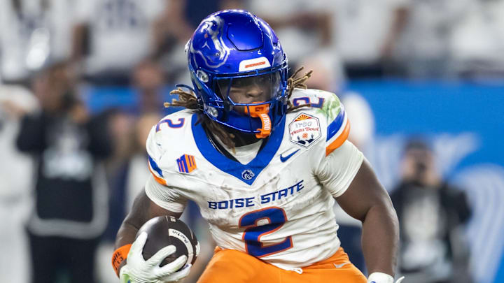 Boise State running back Ashton Jeanty runs with the ball. Boise State running back Ashton Jeanty runs with the ball.