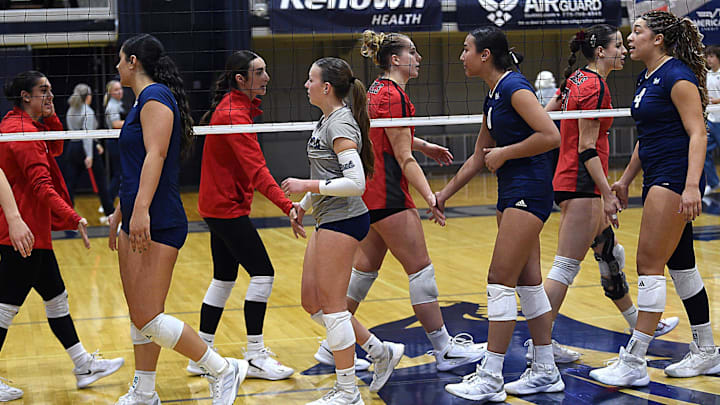 The Nevada volleyball team shakes hands with UNLV after falling to the Rebels 3-1 at the Old Virginia St. Gym in Reno on Nov. 16, 2024.