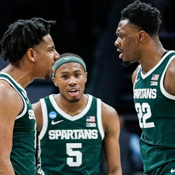 Michigan State guard A.J. Hoggard (11), guard Tre Holloman (5) and center Mady Sissoko (22) celebrate a play against Mississippi State during the second half of NCAA tournament West Region first round at Spectrum Center in Charlotte, N.C. on Thursday, March 21, 2024.