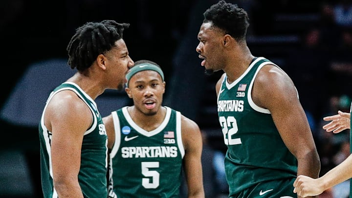 Michigan State guard A.J. Hoggard (11), guard Tre Holloman (5) and center Mady Sissoko (22) celebrate a play against Mississippi State during the second half of NCAA tournament West Region first round at Spectrum Center in Charlotte, N.C. on Thursday, March 21, 2024.