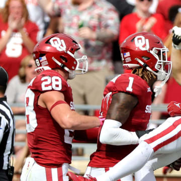 Oklahoma defenders Jaren Kanak (7), Kendel Dolby (15), Dasan McCullough (1) and Danny Stutsman (28) 