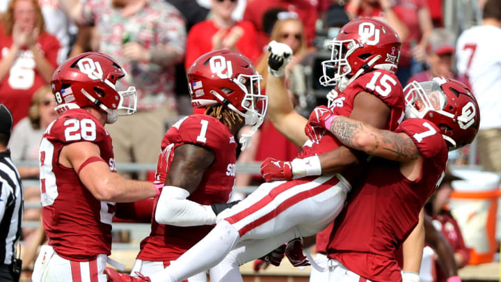 Oklahoma defenders Jaren Kanak (7), Kendel Dolby (15), Dasan McCullough (1) and Danny Stutsman (28) 