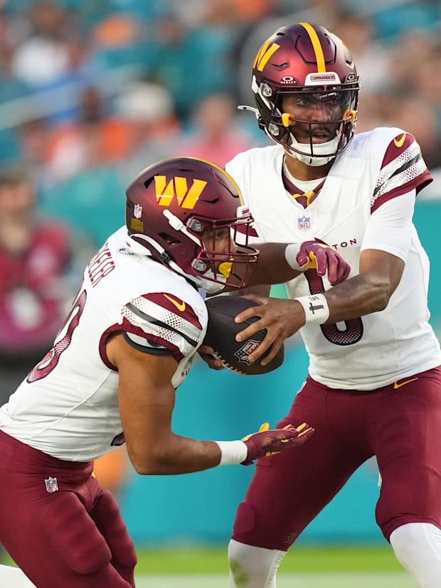 Washington Commanders quarterback Jayden Daniels (5) and running back Austin Ekeler (30)