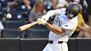 Sep 3, 2025; St. Petersburg, Florida, USA; Tampa Bay Rays second baseman Brandon Lowe (8) hits a single in the first inning against the Seattle Mariners at George M. Steinbrenner Field. Mandatory Credit: Jonathan Dyer-Imagn Images