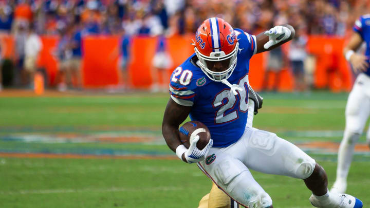 Vanderbilt Commodores linebacker CJ Taylor (1) is knocked down by Florida Gators running back Treyaun Webb (20) in the second half at Steve Spurrier Field at Ben Hill Griffin Stadium in Gainesville, FL on Saturday, October 7, 2023. [Doug Engle/Gainesville Sun]