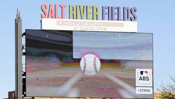 The scoreboard shows the ball touching the strike zone after Arizona Diamondbacks pitcher Corbin Burnes wins the first ABS challenge against the Colorado Rockies in his debut on opening day of spring training season at Salt River Fields at Talking Stick in Scottsdale on Feb. 21, 2025.