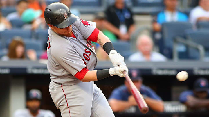 Aug 12, 2017; Bronx, NY, USA; Boston Red Sox catcher Christian Vasquez (7) singles against the New York Yankees during the eighth inning at Yankee Stadium. Mandatory Credit: Andy Marlin-Imagn Images