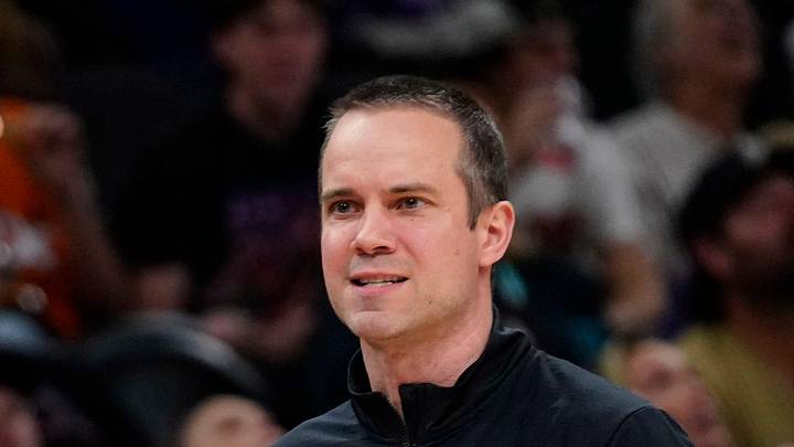 Suns head coach Jordan Ott talks with a referee during a game at Mortgage Matchup Center in Phoenix, Ariz. on Feb. 7, 2026.