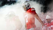 Ohio State wide receiver Phillip Bell takes the field with his Buckeyes teammates before a game. The Buckeyes are solidly into the CFP, but what if they were not?