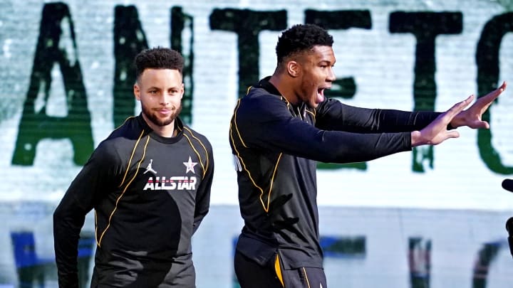 Stephen Curry of the Golden State Warriors (30) and Giannis Antetokounmpo of the Milwaukee Bucks (34)  before the 2021 NBA All-Star Game at State Farm Arena.