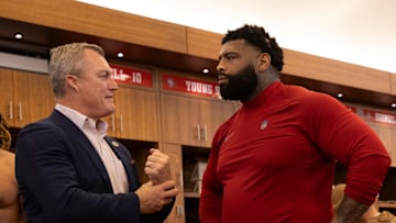 San Francisco 49ers general manager John Lynch (L) and left tackle Trent Williams (L)