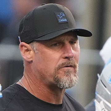 Detroit Lions head coach Dan Campbell works with his team in pre-game at the Pro Football Hall of Fame game