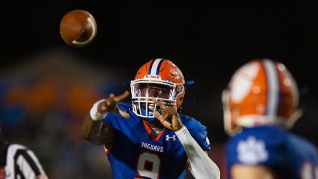 Madison Central's Vic Sutton (9) throws a pass to Jake Norris (17) during their game against Grenada.