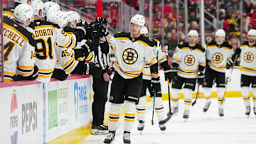 Mar 6, 2025; Raleigh, North Carolina, USA;  Boston Bruins center Morgan Geekie (39) celebrates his goal against the Carolina Hurricanes during the third period at Lenovo Center. Mandatory Credit: James Guillory-Imagn Images