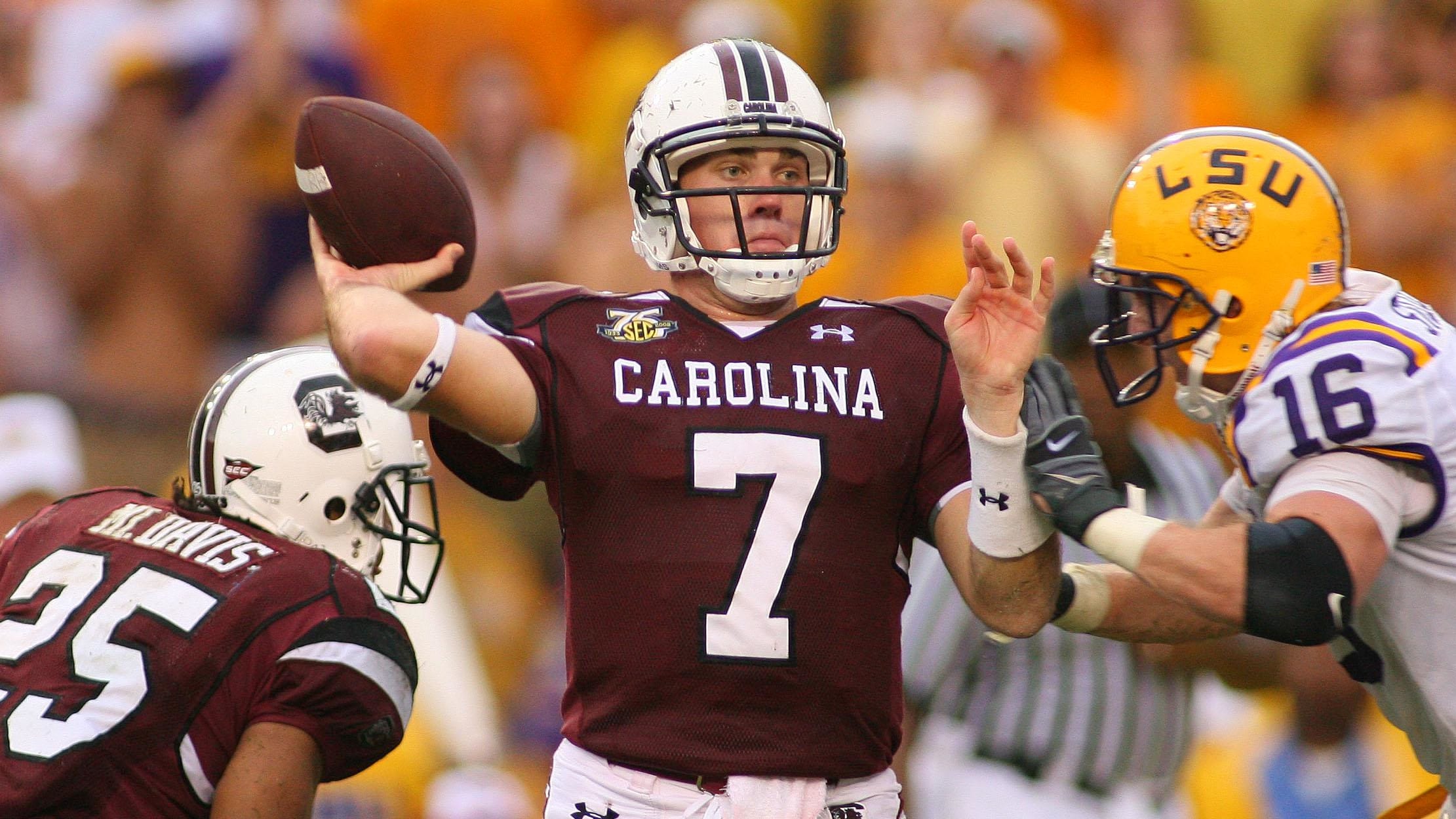 South Carolina Gamecocks quarterback Chris Smelley attempts a pass during a college football game in the SEC.