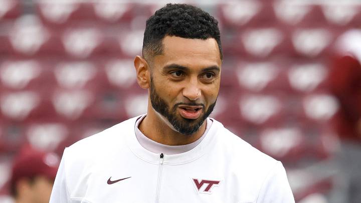 Oct 16, 2021; Blacksburg, Virginia, USA;  Virginia Tech Hokies defensive Coordinator Justin Hamilton watches warmups before the game against the Pittsburgh Panthers at Lane Stadium. Mandatory Credit: Reinhold Matay-Imagn Images