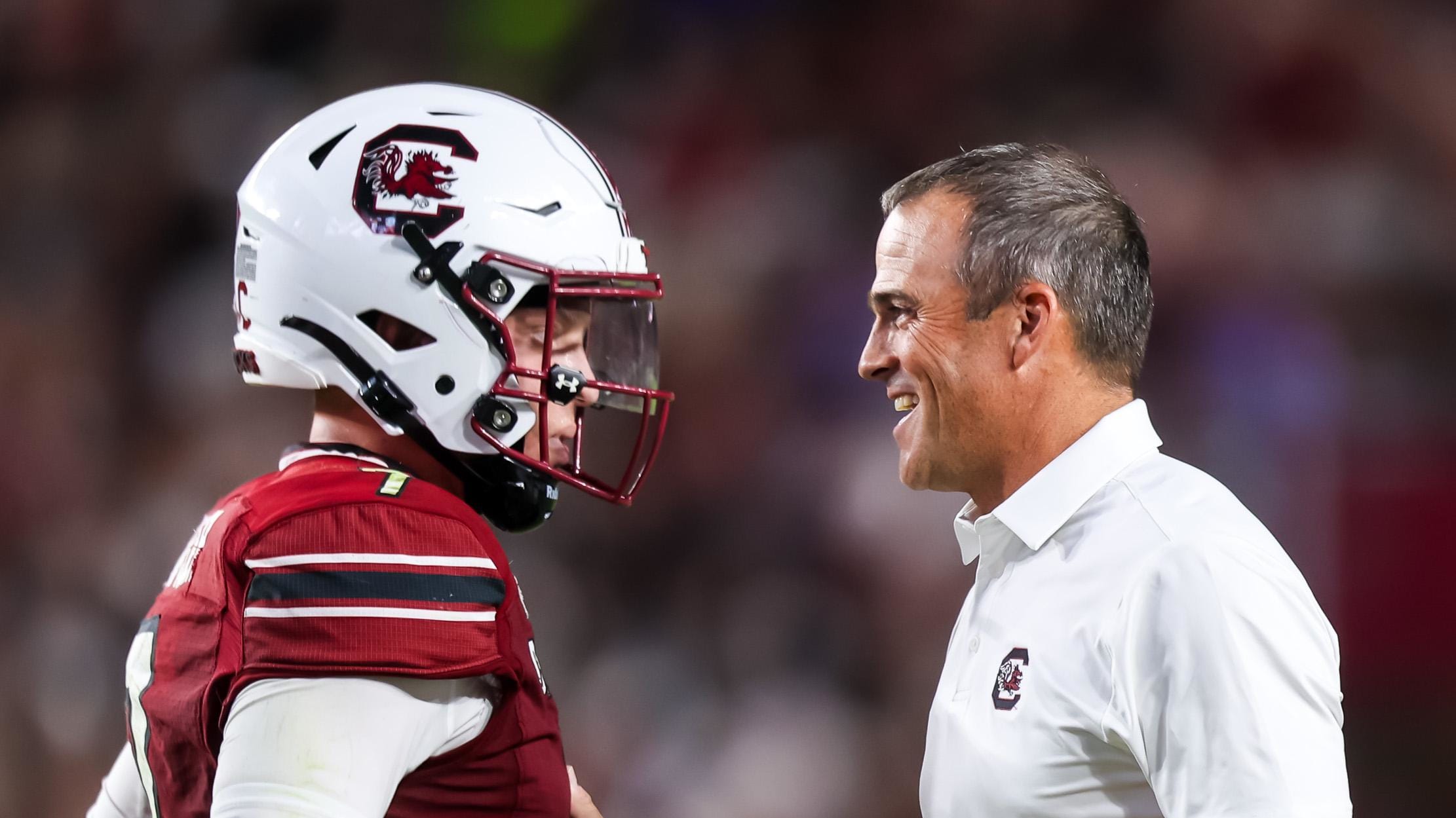 South Carolina Gamecocks head coach Shane Beamer talks with quarterback Spencer Rattler.