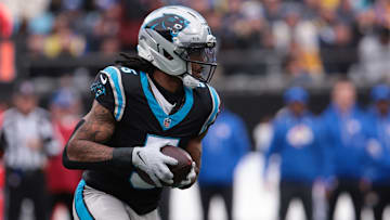 Nov 30, 2025; Charlotte, North Carolina, USA; Carolina Panthers running back Rico Dowdle (5) rushes during the first quarter against the Los Angeles Rams at Bank of America Stadium. 