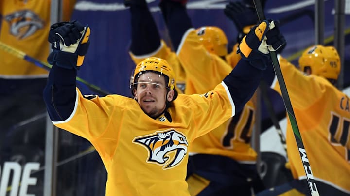 May 8, 2021; Nashville, Tennessee, USA; Nashville Predators left wing Erik Haula (56) celebrates after an empty net goal during the third period against the Carolina Hurricanes at Bridgestone Arena. Mandatory Credit: Christopher Hanewinckel-Imagn Images