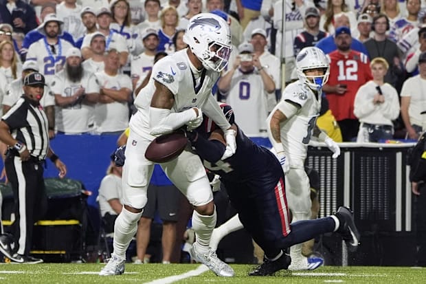 Buffalo Bills wide receiver Keon Coleman makes a catch and then fumbles the ball against the New England Patriots.