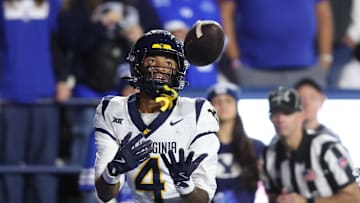 Oct 3, 2025; Provo, Utah, USA; West Virginia Mountaineers wide receiver Cam Vaughn (4) makes a catch for a touchdown against the Brigham Young Cougars during the fourth quarter at LaVell Edwards Stadium. Mandatory Credit: Rob Gray-Imagn Images