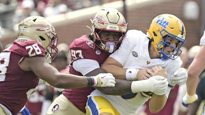 Oct 11, 2025; Tallahassee, Florida, USA; Florida State Seminoles defensive lineman Mandrell Desir (93) sacks Pittsburgh Panthers quarterback Mason Heintschel (6) during the first half at Doak S. Campbell Stadium. Mandatory Credit: Melina Myers-Imagn Images