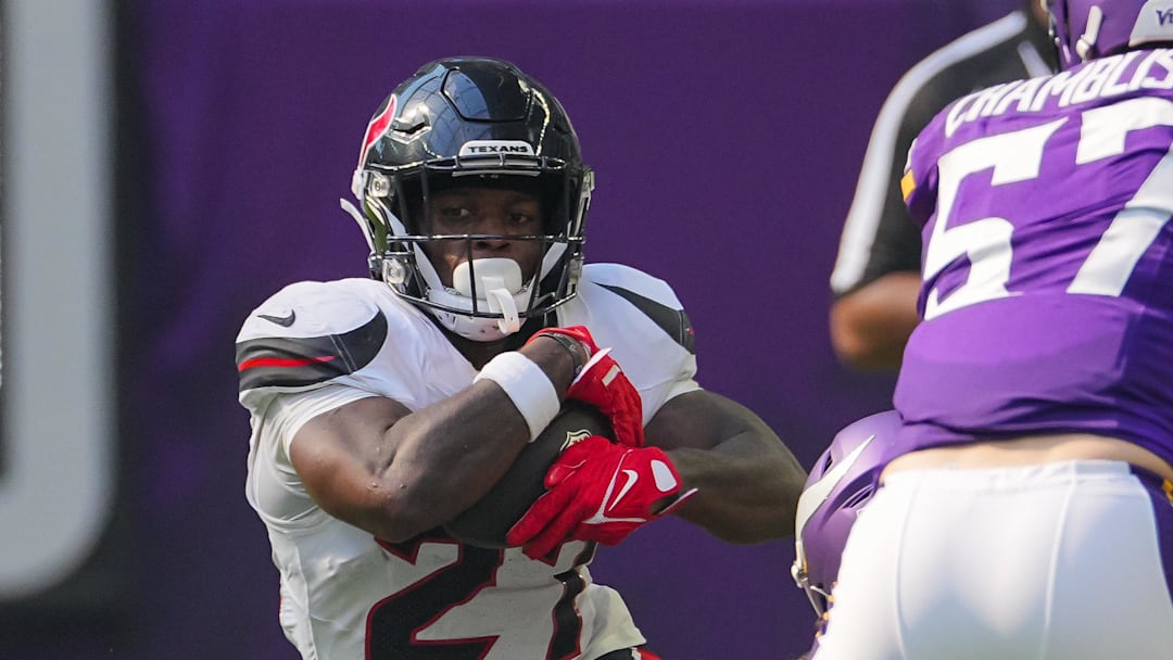 Aug 9, 2025; Minneapolis, Minnesota, USA; Houston Texans running back Woody Marks (27) runs with the ball against the Minnesota Vikings in the third quarter at U.S. Bank Stadium. Mandatory Credit: Brad Rempel-Imagn Images