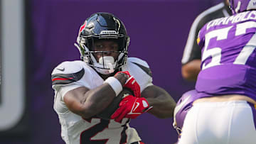 Aug 9, 2025; Minneapolis, Minnesota, USA; Houston Texans running back Woody Marks (27) runs with the ball against the Minnesota Vikings in the third quarter at U.S. Bank Stadium. Mandatory Credit: Brad Rempel-Imagn Images