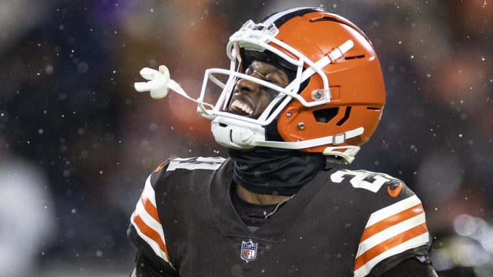 Dec 17, 2022; Cleveland, Ohio, USA; Cleveland Browns cornerback Denzel Ward (21) celebrates a turnover on downs by the Baltimore Ravens during the fourth quarter at FirstEnergy Stadium. Mandatory Credit: Scott Galvin-USA TODAY Sports