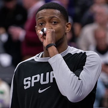 Mar 7, 2025; Sacramento, California, USA; San Antonio Spurs guard De'Aaron Fox (4) looks on during pregame warm ups before the game against the Sacramento Kings at Golden 1 Center.