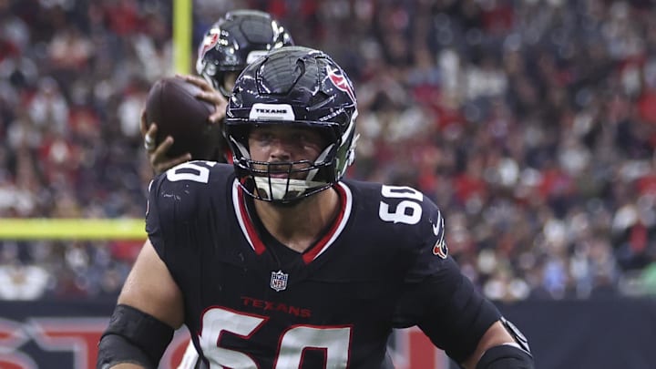 Dec 14, 2025; Houston, Texas, USA; Houston Texans center Jake Andrews (60) in action during a play in the first half against the Arizona Cardinals at NRG Stadium. Mandatory Credit: Troy Taormina-Imagn Images