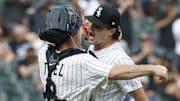 Chicago White Sox pitcher Mike Vasil (61) and catcher Kyle Teel (8) celebrate a win against the San Francisco Giants at Rate Field. 