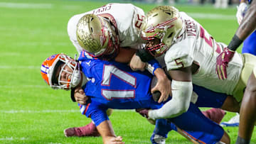 Florida Gators quarterback Max Brown (17) gets stopped by Florida State Seminoles defensive lineman Jared Verse (5) and Florida State Seminoles defensive lineman Braden Fiske (55) during first half action as Florida takes on Florida State at Steve Spurrier Field at Ben Hill Griffin Stadium in Gainesville, FL on Saturday, November 25, 2023. [Alan Youngblood/Gainesville Sun]