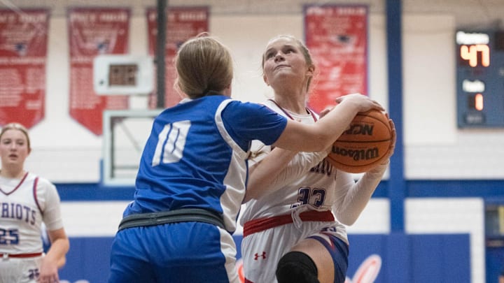 Grace Manor (33) is fouled while driving to the hoop during the Jay vs Pace girls basketball game at Pace High School on Tuesday, Jan. 16, 2024.