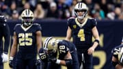 Jan 7, 2024; New Orleans, Louisiana, USA;  New Orleans Saints quarterback Derek Carr (4) looks over the Atlanta Falcons defense during the first half at Caesars Superdome. Mandatory Credit: Stephen Lew-USA TODAY Sports