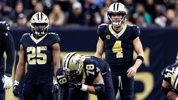 Jan 7, 2024; New Orleans, Louisiana, USA;  New Orleans Saints quarterback Derek Carr (4) looks over the Atlanta Falcons defense during the first half at Caesars Superdome. Mandatory Credit: Stephen Lew-USA TODAY Sports