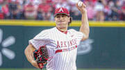Arkansas Razorbacks pitcher Landon Beidelschies throws to the plate against the Texas A&M Aggies at Baum-Walker Stadium in Fayetteville, Ark.