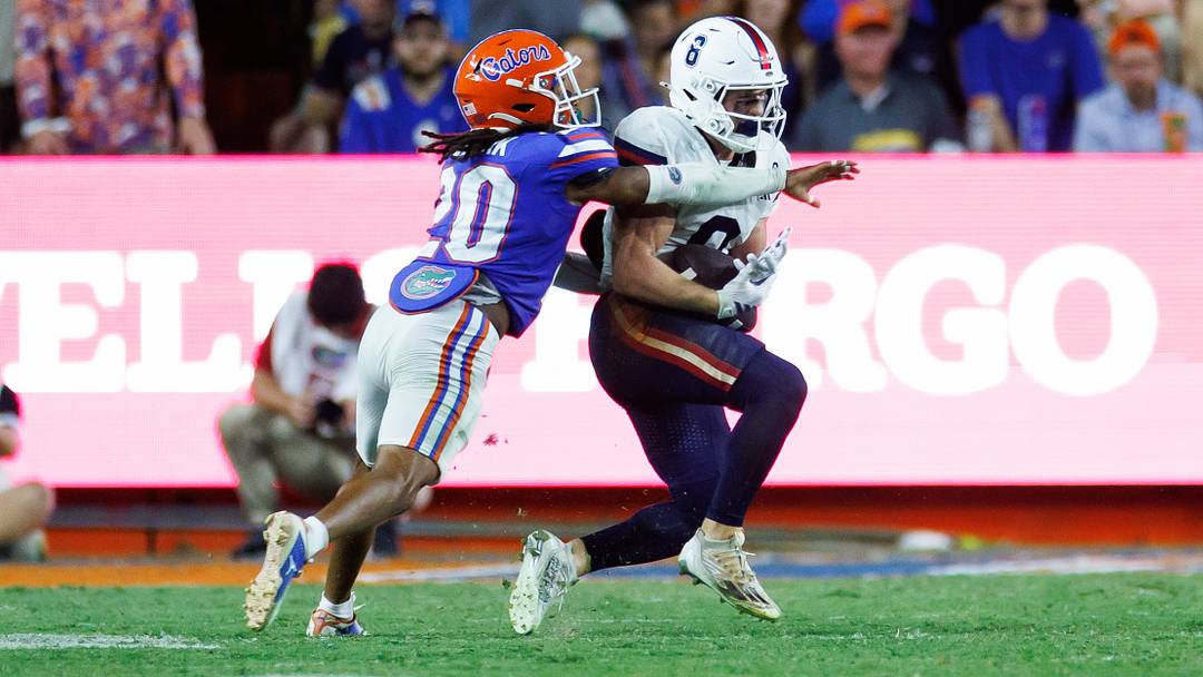 Sep 5, 2026; Gainesville, Florida, USA;  Florida Atlantic Owls wide receiver Branden Hoch (0) makes a catch over Florida Gators star Kanye Clark (20) during the first half at Ben Hill Griffin Stadium.  Mandatory Credit: Matt Pendleton-Imagn Images