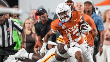 Texas Longhorns defensive back Jay'Vion Cole (13) runs the ball forward following an interception as the Texas Longhorns take on ULM at Darrell K Royal-Texas Memorial Stadium in Austin Saturday, Sept. 21, 2024.