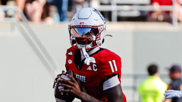 Oct 4, 2025; Raleigh, North Carolina, USA; NC State Wolfpack quarterback CJ Bailey (11) with the ball during the second half of the game against Campbell Fighting Camels at Carter-Finley Stadium. Mandatory Credit: Jaylynn Nash-Imagn Images