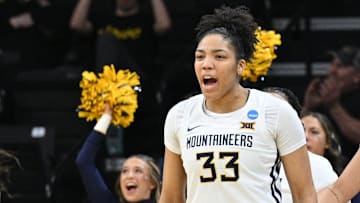 Mar 23, 2024; Iowa City, IA, USA; West Virginia Mountaineers guard Tirzah Moore (33) reacts at the end of the second quarter against the Princeton Tigers of the NCAA first round game at Carver-Hawkeye Arena. Mandatory Credit: Jeffrey Becker-Imagn Images