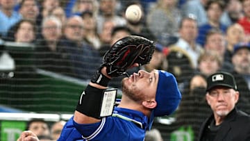 Apr 29, 2022; Toronto, Ontario, CAN;   Toronto Blue Jays catcher Alejandro Kirk (30) catches a pop foul hit by Houston Astros first baseman Yuli Gurriel (not shown) as home plate umpire Lance Barksdale looks on in the eighth inning at Rogers Centre. Mandatory Credit: Dan Hamilton-Imagn Images