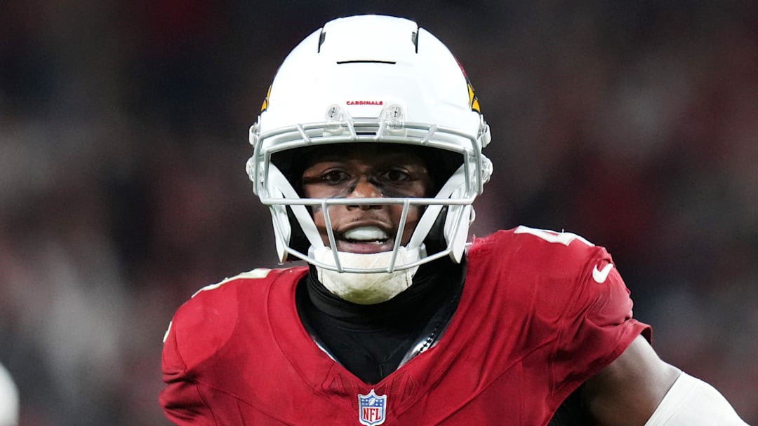 Arizona Cardinals receiver Greg Dortch (4) runs in for a touchdown after a catch against the Jacksonville Jaguars at State Farm Stadium on Nov. 23, 2025.
