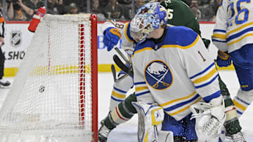 Mar 22, 2025; Saint Paul, Minnesota, USA;  Minnesota Wild forward Justin Brazeau (15) gets behind Buffalo Sabres goalie Ukko-Pekka Luukkonen (1) to score a goal as defenseman Rasmus Dahlin (26) defends during the second period at Xcel Energy Center. Mandatory Credit: Nick Wosika-Imagn Images