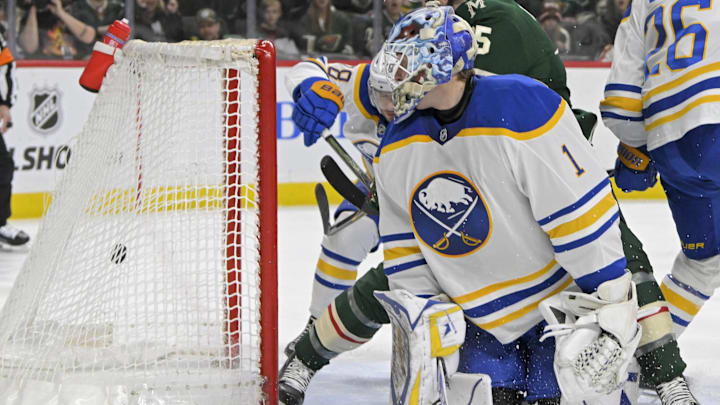 Mar 22, 2025; Saint Paul, Minnesota, USA;  Minnesota Wild forward Justin Brazeau (15) gets behind Buffalo Sabres goalie Ukko-Pekka Luukkonen (1) to score a goal as defenseman Rasmus Dahlin (26) defends during the second period at Xcel Energy Center. Mandatory Credit: Nick Wosika-Imagn Images